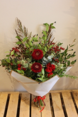 Mixed Christmas Flower Bouquet with Red Roses and Thistle Available for local delivery in Cheadle and Stockport