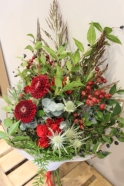 Mixed Christmas Flower Bouquet with Red Roses and Thistle Available for local delivery in Cheadle and Stockport