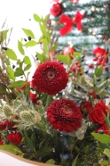 Mixed Christmas Flower Bouquet with Red Roses and Thistle Available for local delivery in Cheadle and Stockport